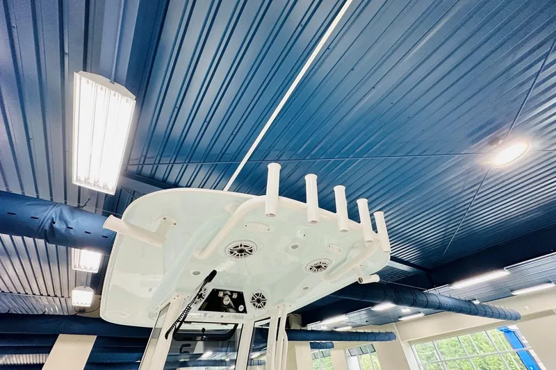 Slide: The Image of Ceiling view of 2026 Sportsman Masters 267 Bay Boat with rod holders and speakers. - 5