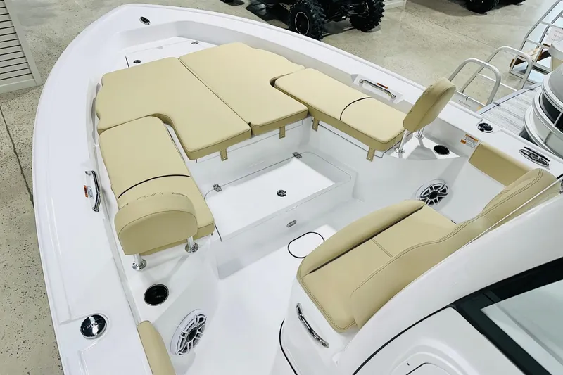 Slide: The Image of 2026 Sportsman Masters 267 Bay Boat interior with beige seating and modern design. - 6