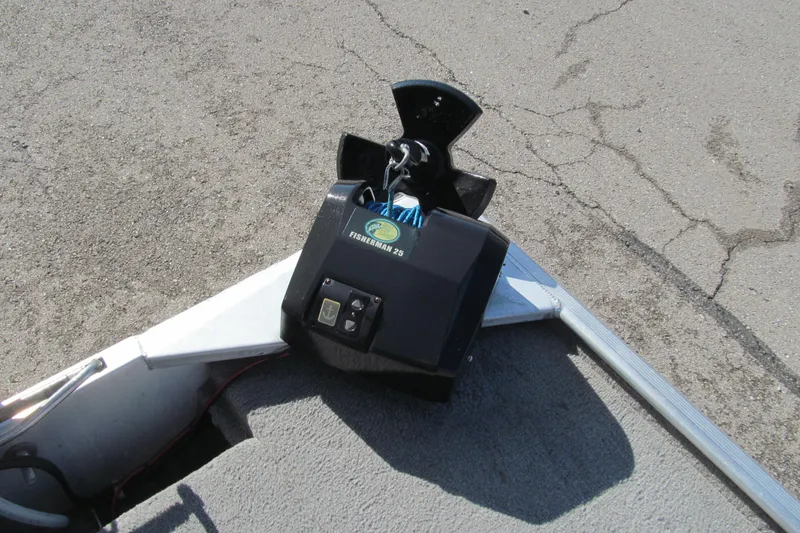 Slide: The Image of 2010 Tracker Pro 16 boat with Fisherman 25 anchor winch on concrete surface. - 11