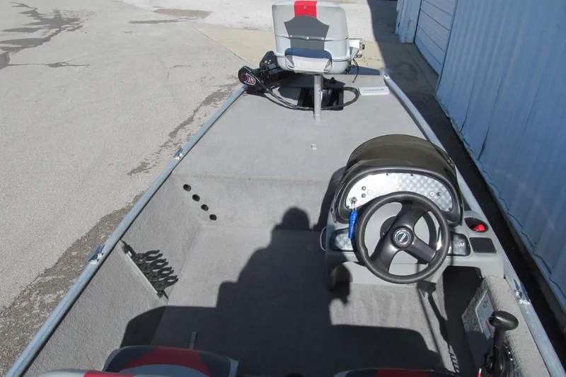 Slide: The Image of 2010 Tracker Pro 16 boat interior with steering wheel and seating. - 4