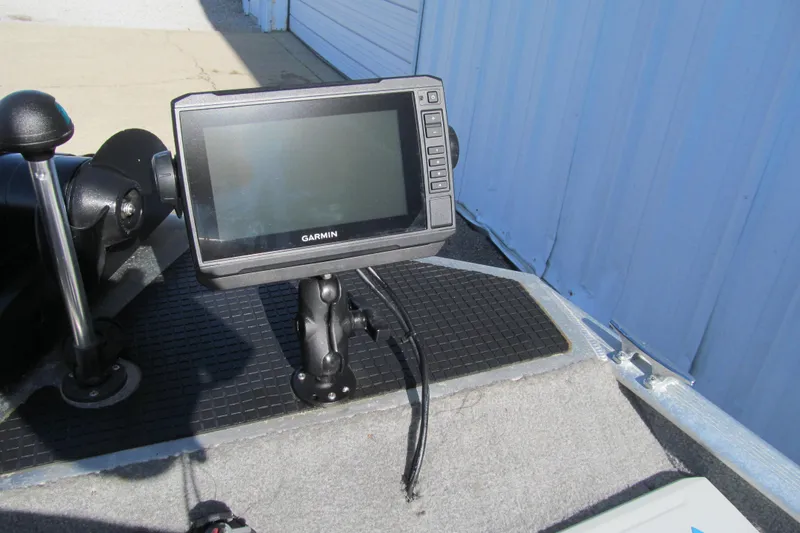 Slide: The Image of Garmin fishfinder on 2010 Tracker Pro 16 boat deck, near control lever. - 9