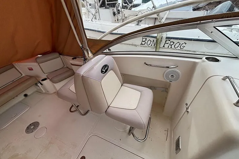 Slide: The Image of 2007 Scout 222 Dorado boat interior with seating and canopy. - 13