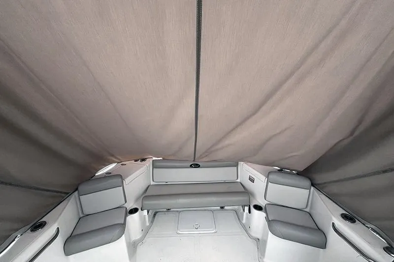 Slide: The Image of Interior of 2007 Scout 222 Dorado boat with gray seating and canopy. - 14