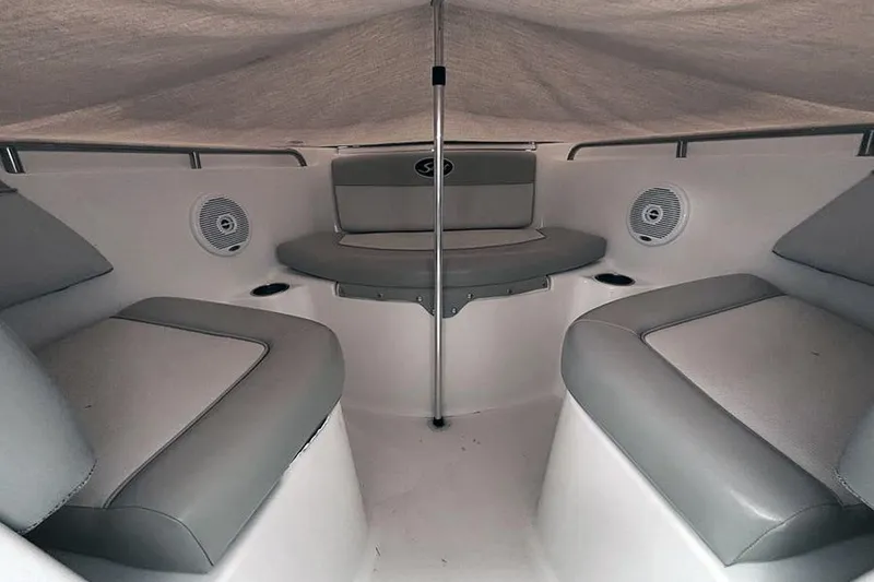 Slide: The Image of 2007 Scout 222 Dorado boat interior with cushioned seating and speakers. - 18