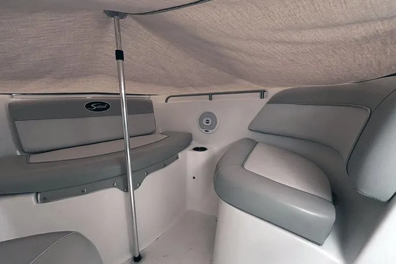 Slide: The Image of Interior of 2007 Scout 222 Dorado boat with gray seating and canopy. - 19