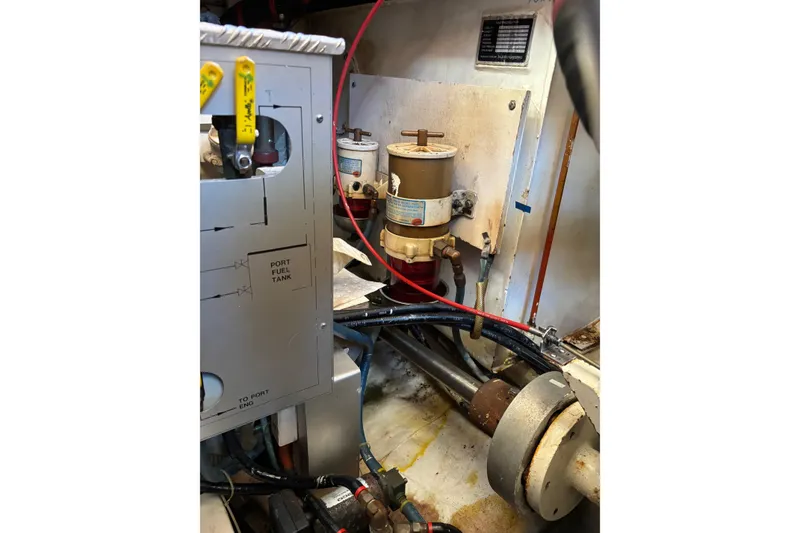 Slide: The Image of Engine room of 1996 Grand Banks 36 Motoryacht, showing fuel system components and wiring. - 24