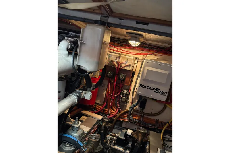 Slide: The Image of Engine room of 1996 Grand Banks 36 Motoryacht with wiring and machinery components. - 25