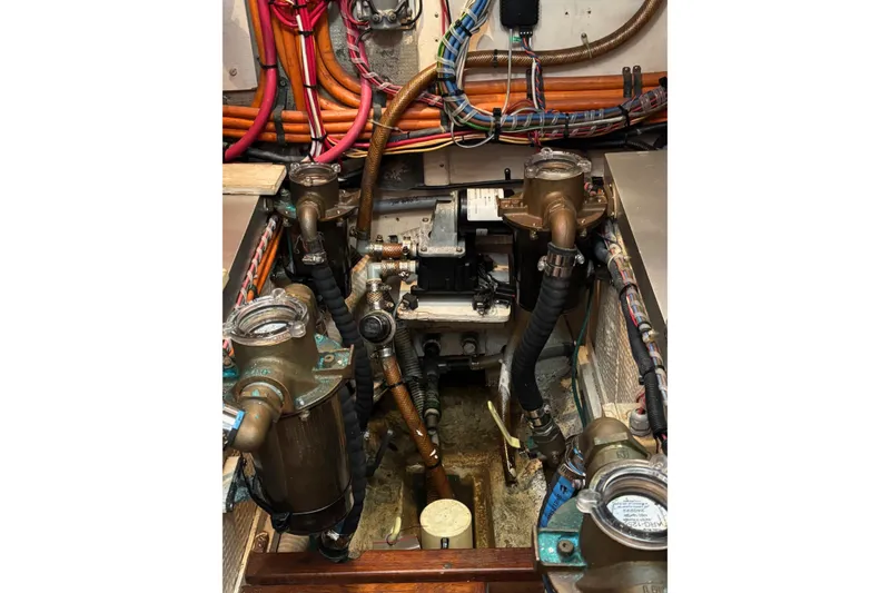 Slide: The Image of Engine room of a 1996 Grand Banks 36 Motoryacht with visible wiring and components. - 29