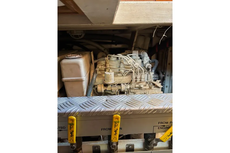 Slide: The Image of Engine compartment of a 1996 Grand Banks 36 Motoryacht, showcasing mechanical components. - 30
