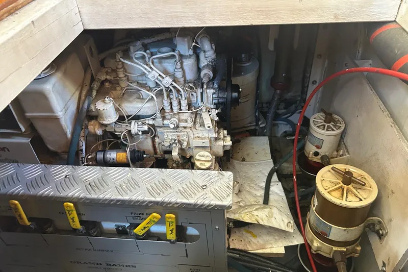 Slide: The Image of Engine room of 1996 Grand Banks 36 Motoryacht with visible machinery and components. - 33
