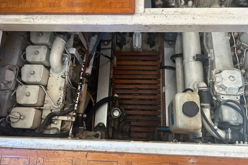 Slide: The Image of Engine room of a 1996 Grand Banks 36 Motoryacht, showcasing mechanical components and layout. - 34