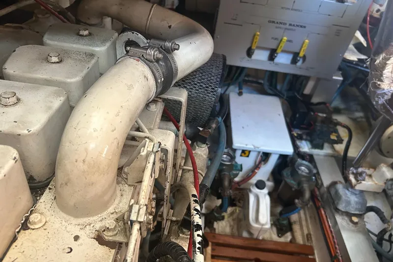 Slide: The Image of Engine room of 1996 Grand Banks 36 Motoryacht, showing mechanical components and wiring. - 35