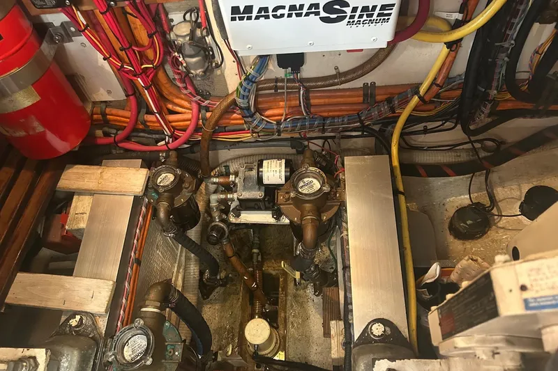 Slide: The Image of Engine room of 1996 Grand Banks 36 Motoryacht with wiring and machinery. - 37
