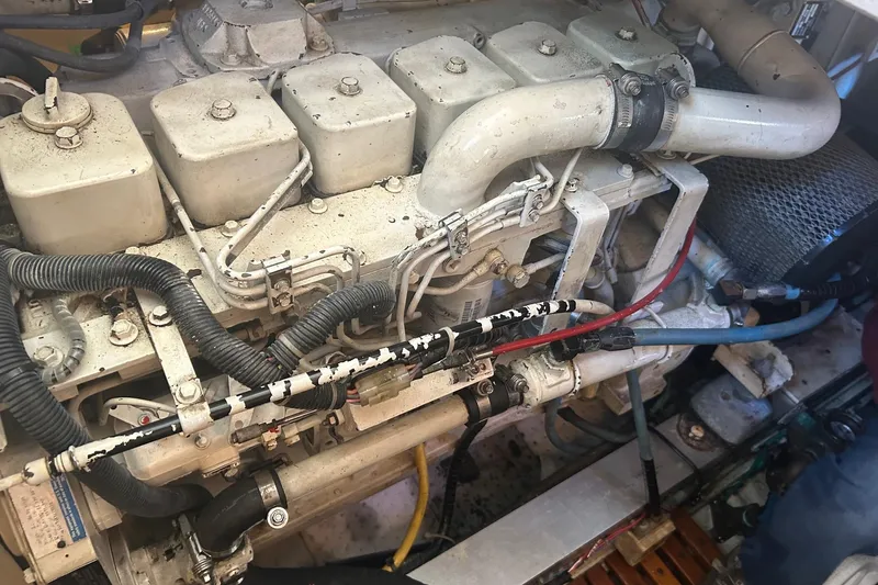 Slide: The Image of Engine compartment of a 1996 Grand Banks 36 Motoryacht, showcasing mechanical components. - 38