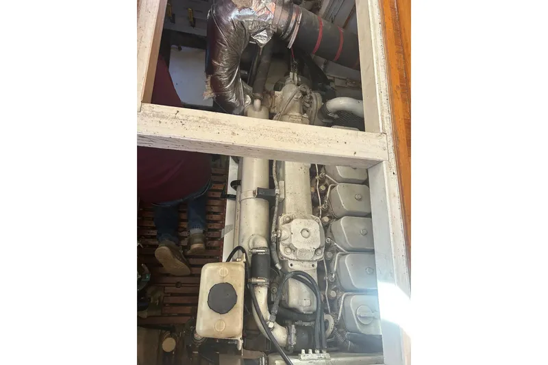 Slide: The Image of Engine compartment of a 1996 Grand Banks 36 Motoryacht, showcasing mechanical components. - 41