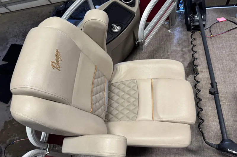 Slide: The Image of Luxurious beige seat on 2020 Ranger Reata 220F boat, featuring quilted design and logo. - 10