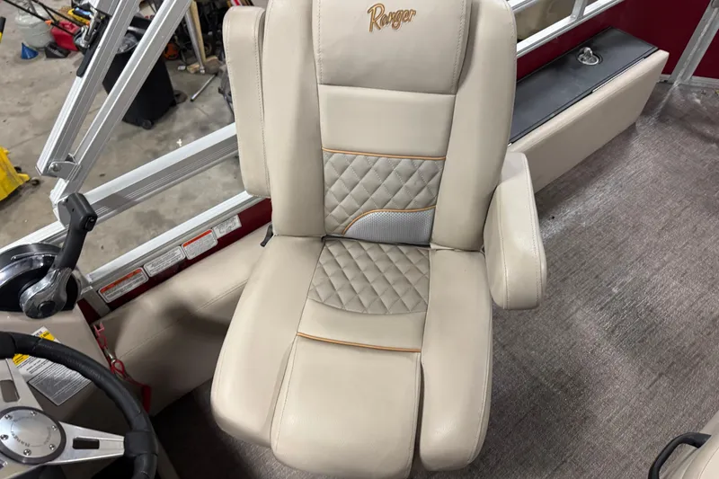 Slide: The Image of 2020 Ranger Reata 220F boat seat with quilted design and armrests. - 15
