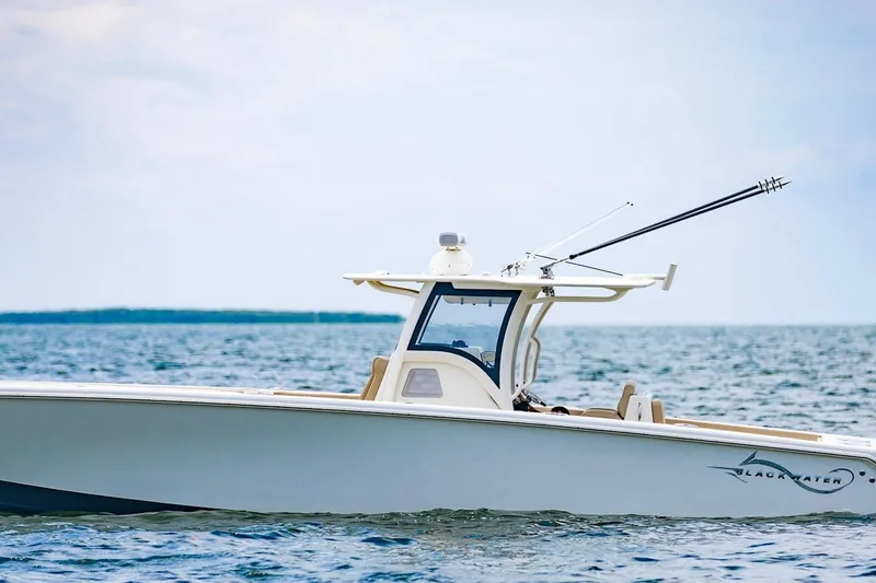 Slide: The Image of 2027 Blackwater 36 Sportfish boat on open water, side view. - 2