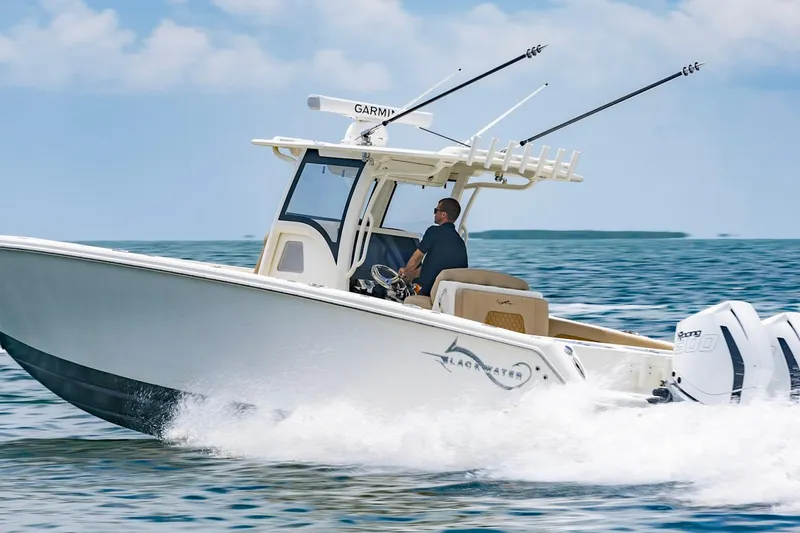 Slide: The Image of 2027 Blackwater 36 Sportfish cruising on open water under a clear sky. - 3