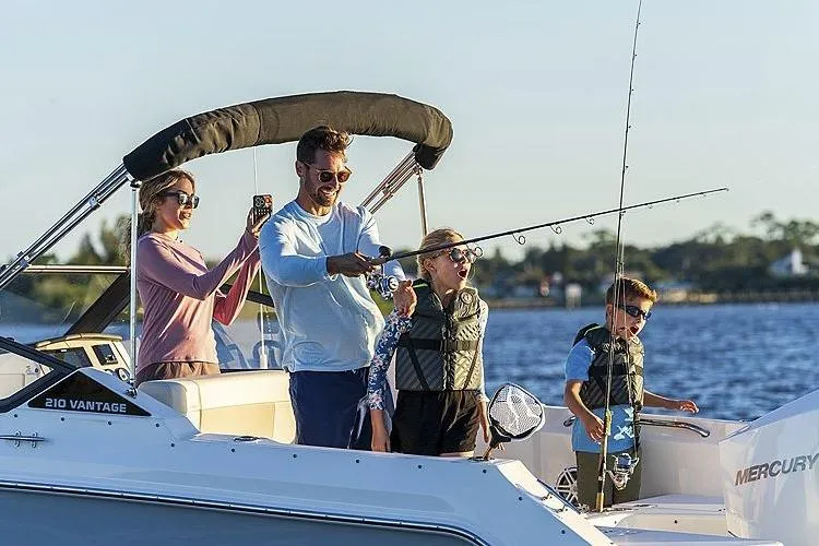 Slide: The Image of Family enjoying fishing on 2024 Boston Whaler 210 Vantage boat. - 14