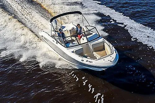 Slide: The Image of 2024 Boston Whaler 210 Vantage boat cruising on open water. - 24