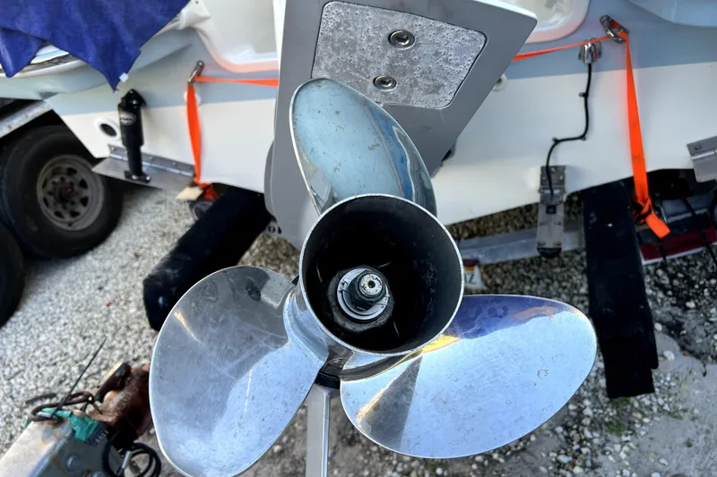 Slide: The Image of Propeller of 2024 Boston Whaler 210 Vantage boat on trailer, close-up view. - 32