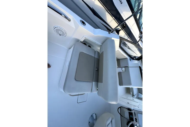 Slide: The Image of 2024 Boston Whaler 210 Vantage boat interior with seating and console details. - 33