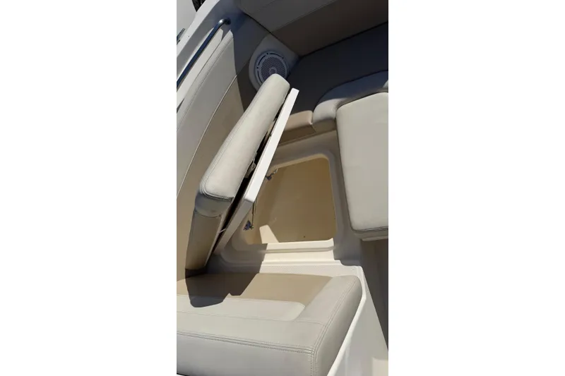 Slide: The Image of 2024 Boston Whaler 210 Vantage boat seat with storage compartment open. - 9