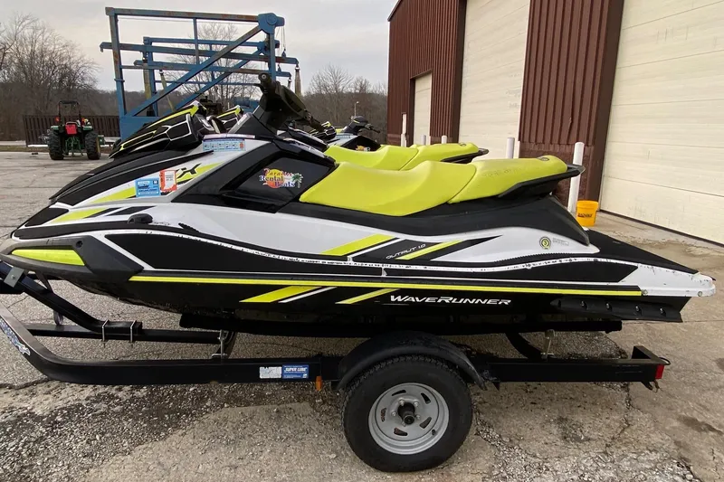 The Image of 2021 Yamaha WaveRunner VX with vibrant yellow seats on a trailer. - 0