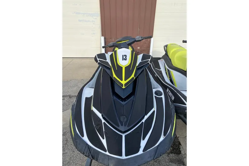 Slide: The Image of 2021 Yamaha WaveRunner VX jet ski with sleek black and yellow design. - 13