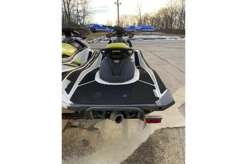 Slide: The Image of 2021 Yamaha WaveRunner VX jet ski parked on pavement, rear view. - 14