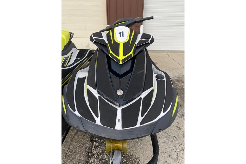 Slide: The Image of 2021 Yamaha WaveRunner VX jet ski with sleek black and yellow design. - 2