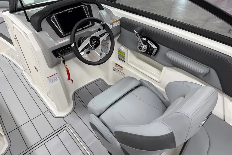 Slide: The Image of 2026 Chaparral 23 SSi boat interior with modern steering and controls. - 12