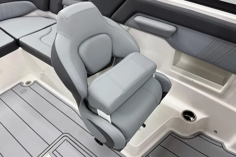 Slide: The Image of 2026 Chaparral 23 SSi boat interior with gray seating and flooring. - 16