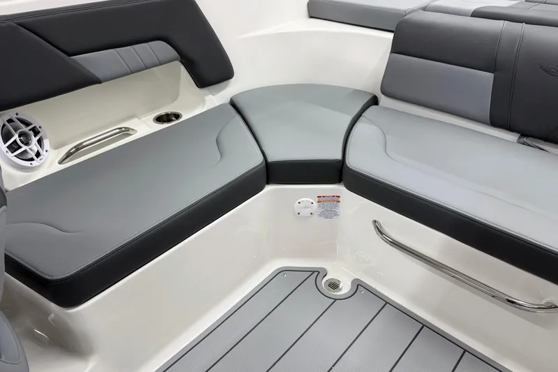 Slide: The Image of 2026 Chaparral 23 SSi boat interior with gray seating and speaker. - 17