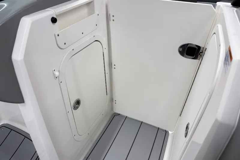 Slide: The Image of 2026 Chaparral 23 SSi boat interior storage compartment with sleek design and modern features. - 26