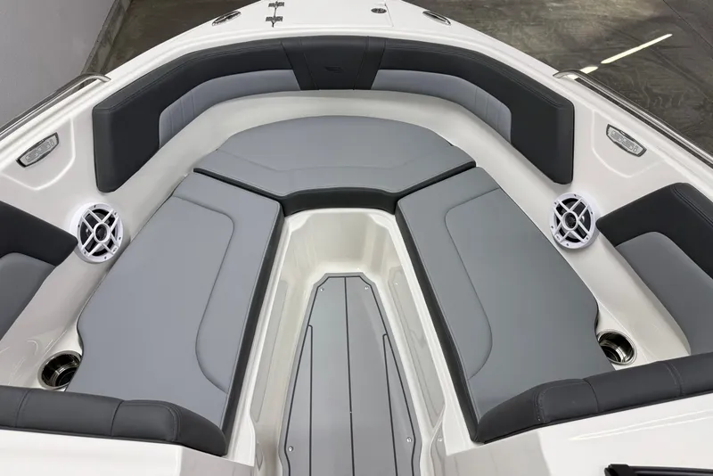 Slide: The Image of 2026 Chaparral 23 SSi boat interior with gray seating and modern design. - 27