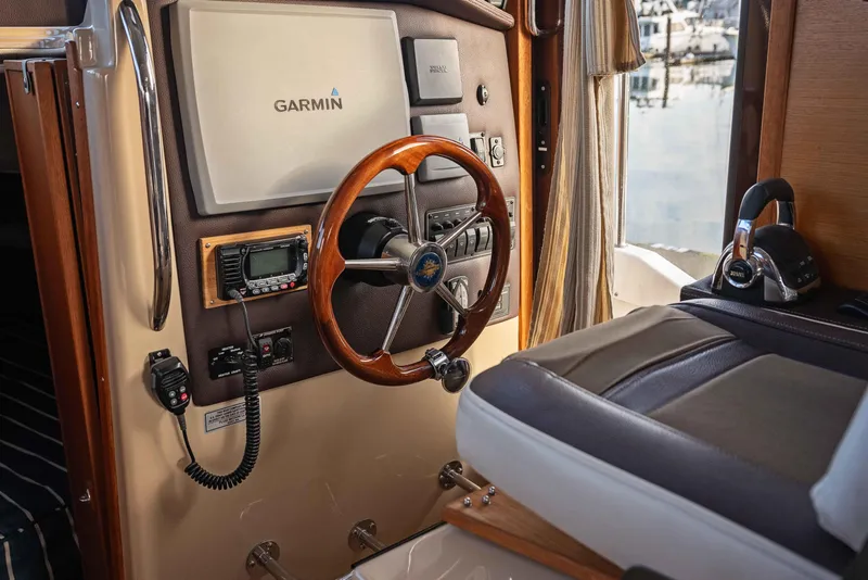 Slide: The Image of Interior helm of 2014 Ranger Tug R-31 CB with Garmin navigation system. - 2