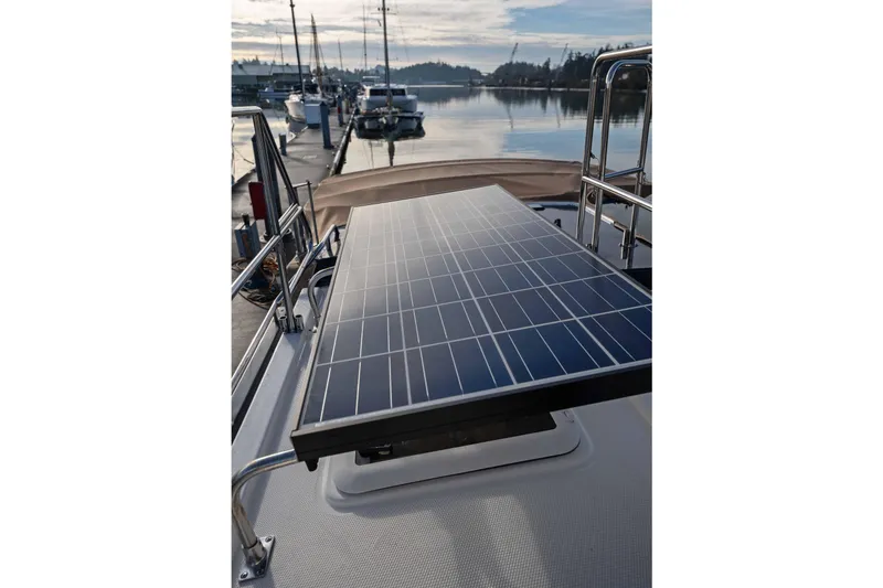 Slide: The Image of 2014 Ranger Tug R-31 CB with solar panel on deck, docked at marina. - 21