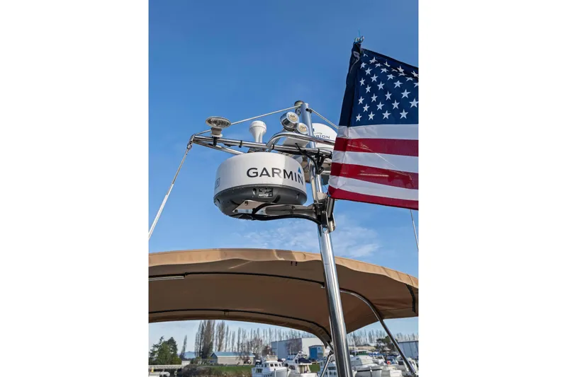 Slide: The Image of 2014 Ranger Tug R-31 CB with Garmin radar and American flag. - 23