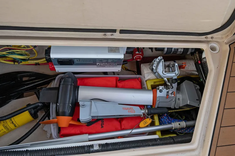 Slide: The Image of Storage compartment of 2014 Ranger Tug R-31 CB with equipment and ProMariner charger. - 34