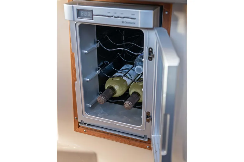 Slide: The Image of Wine cooler on 2014 Ranger Tug R-31 CB with bottles inside. - 35