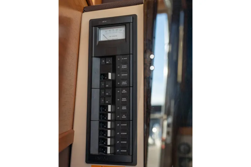 Slide: The Image of Electrical panel on 2014 Ranger Tug R-31 CB boat, featuring circuit breakers and voltage meter. - 36