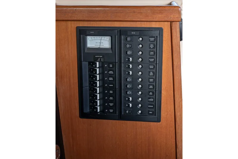 Slide: The Image of Electrical panel of 2014 Ranger Tug R-31 CB with switches and voltmeter. - 38