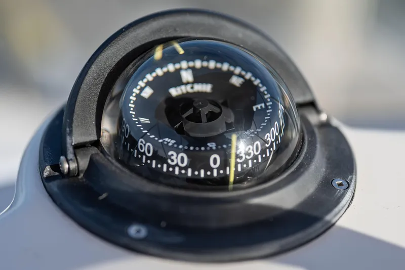 Slide: The Image of Close-up of a compass on a 2014 Ranger Tug R-31 CB boat. - 39