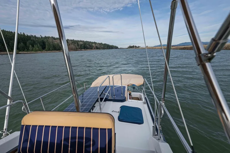 Slide: The Image of 2014 Ranger Tug R-31 CB cruising on a scenic waterway with solar panels. - 41