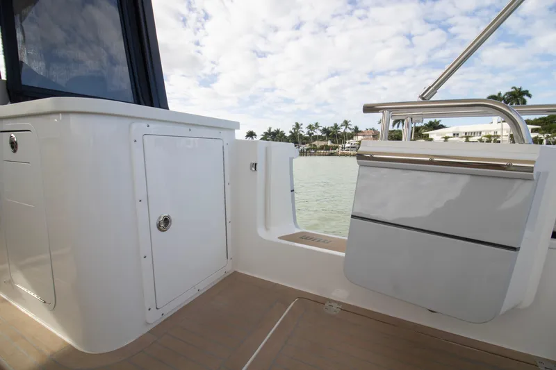 Slide: The Image of 2025 MJM 38 X boat interior with speaker and cup holders. - 21