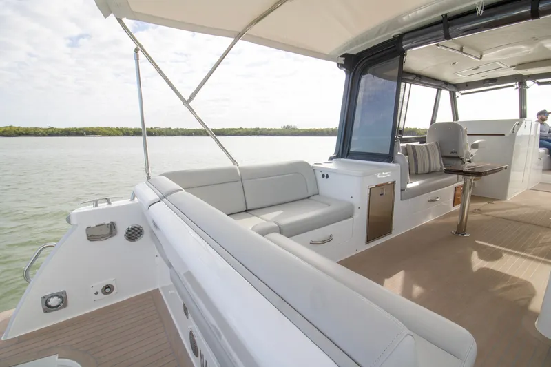 Slide: The Image of Interior of 2025 MJM 38 X yacht with table and storage. - 27