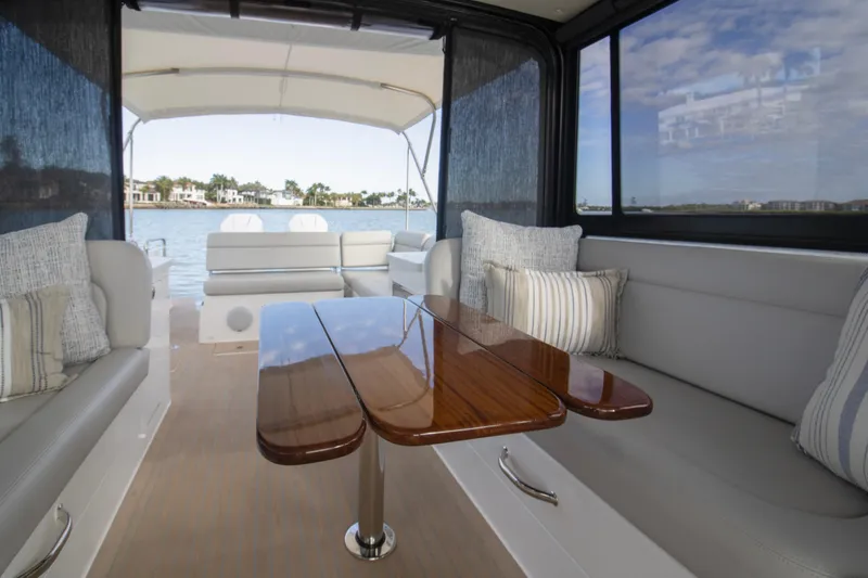 Slide: The Image of Luxurious seating area on 2025 MJM 38 X boat, overlooking serene waters. - 36