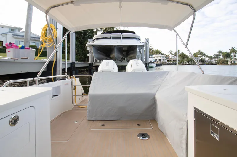 Slide: The Image of 2025 MJM 38 X boat cruising on calm waters, aerial view. - 4